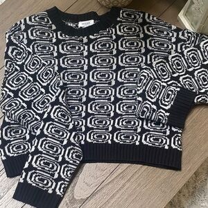 Super cute cropped pattern sweater. Well made quality material.